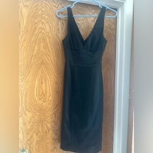 Gorgeous and sexy fitted Bebe dress with slit in the back